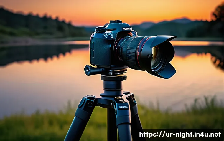 야경을 찍을 때 필요한 액세서리 - A professional night photography setup featuring a sturdy carbon fiber tripod holding a DSLR camera ...