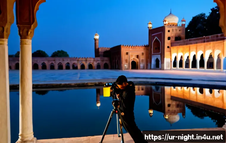 Home 17 야경 촬영 필터 활용법 - Photorealistic night photography scene in Lahore, a Pakistani photographer adjusting a camera on a s...